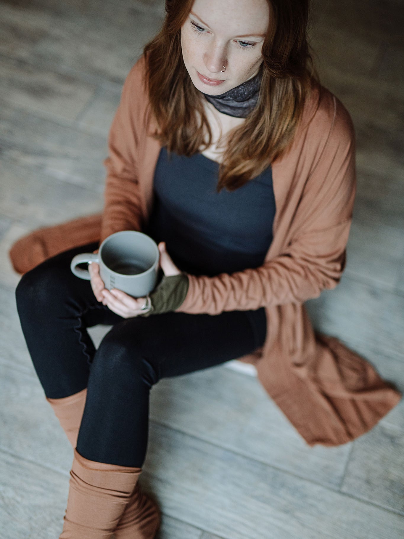 coco blazer in cedar paired with black playsuit, carbon core tank, and cedar stockings