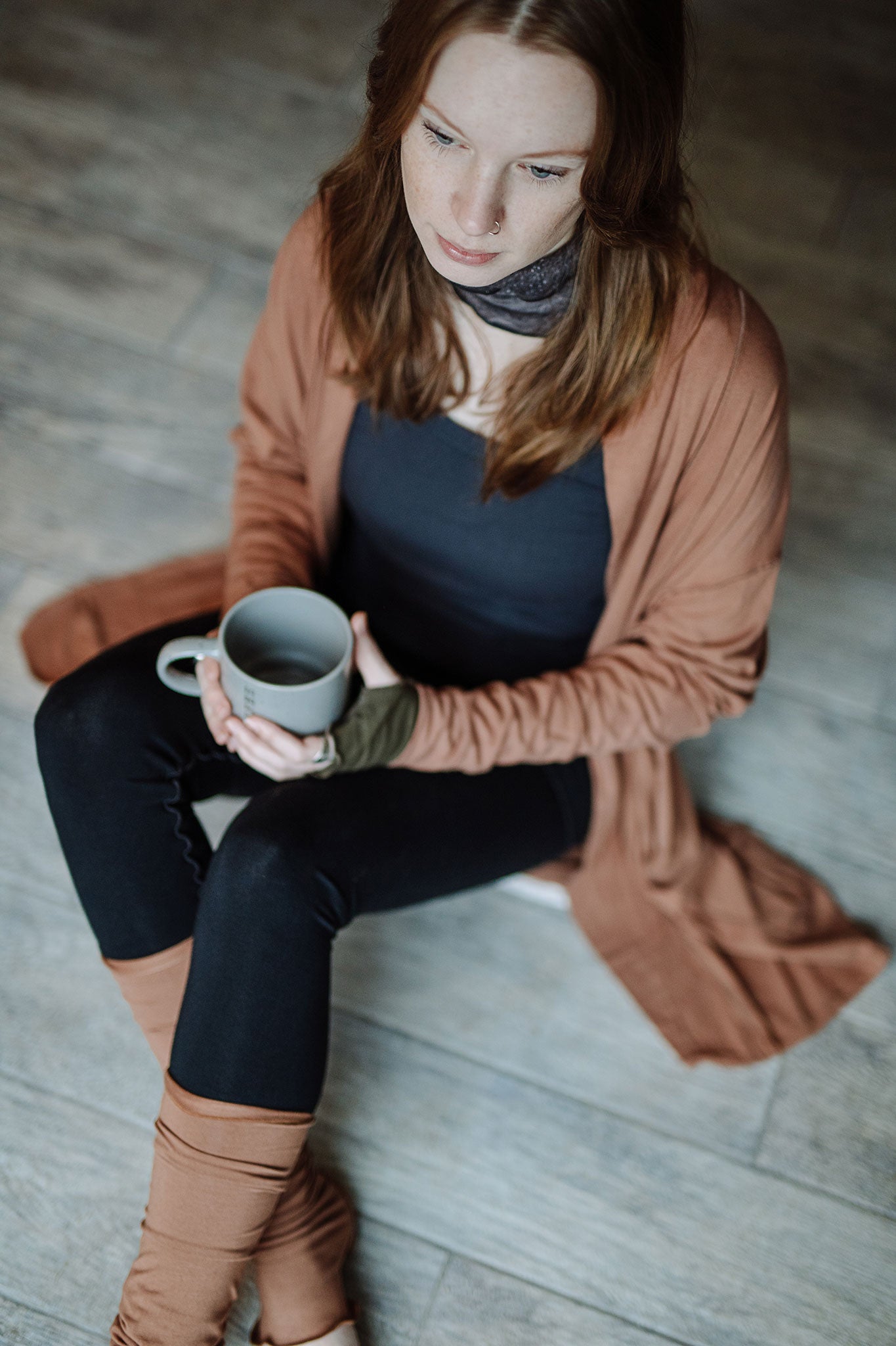 coco blazer in cedar paired with black playsuit, carbon core tank, and cedar stockings