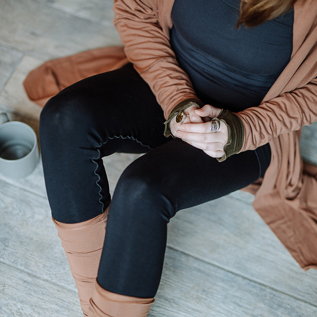 playsuit in black with top section folded over into a skirt; paired with coco jacket in cedar, cedar stockings, and core tank in carbon