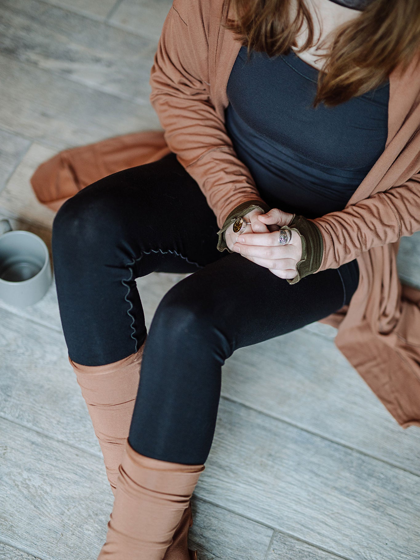playsuit in black with top section folded over into a skirt; paired with coco jacket in cedar, cedar stockings, and core tank in carbon