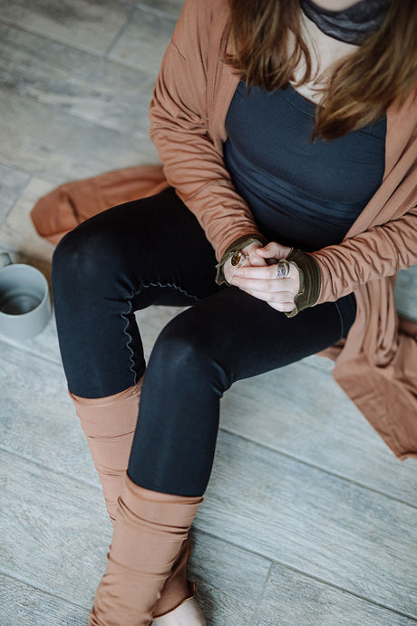playsuit in black with top section folded over into a skirt; paired with coco jacket in cedar, cedar stockings, and core tank in carbon