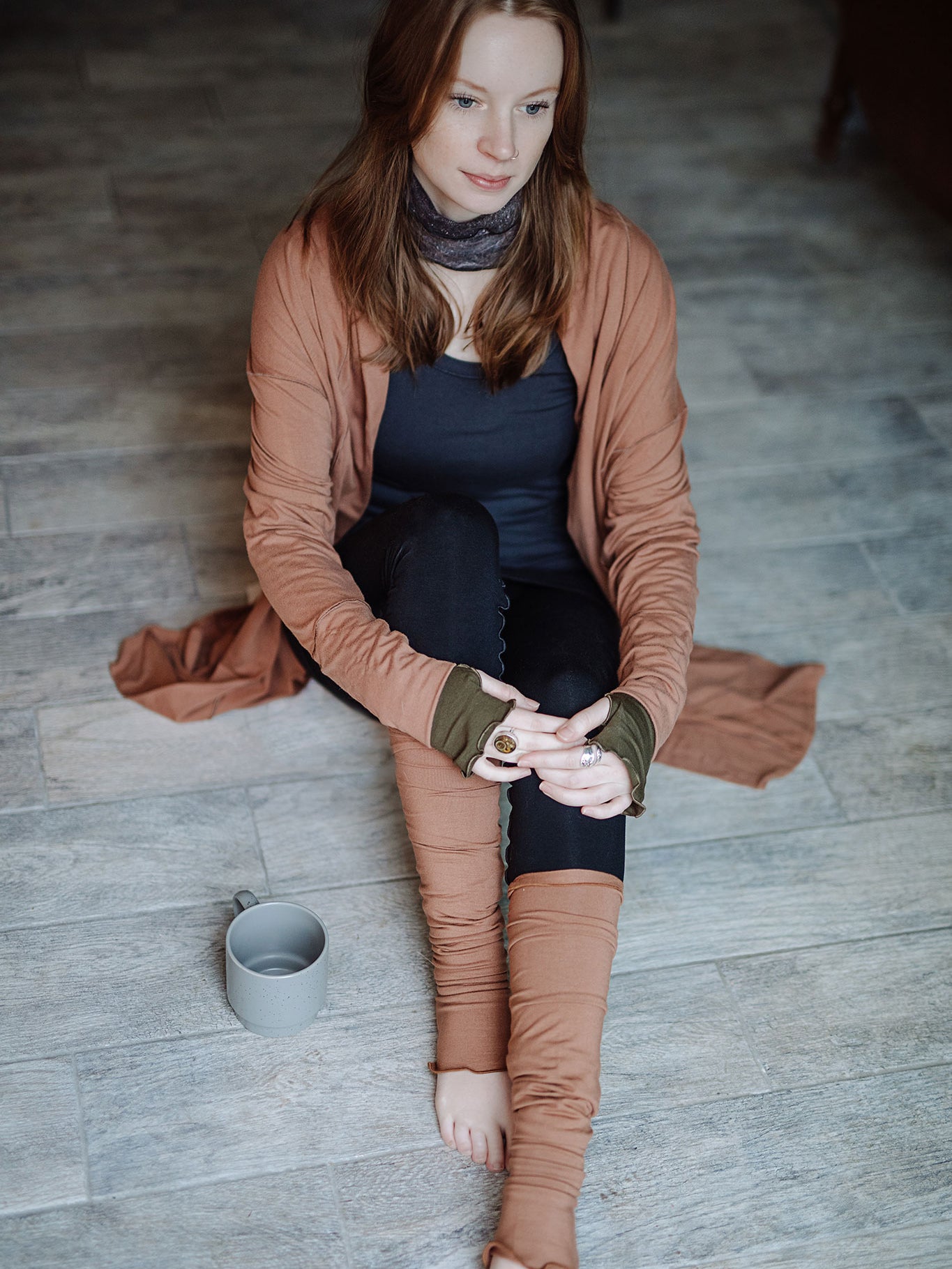 playsuit in black with top section folded over into a skirt; paired with coco jacket in cedar, cedar stockings, and core tank in carbon