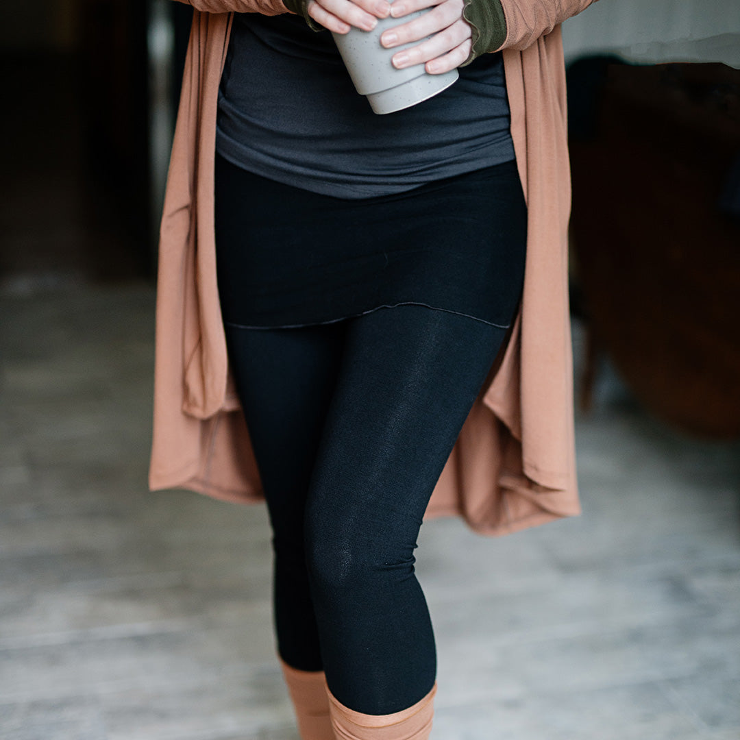 playsuit in black with top section folded over into a skirt; paired with coco jacket in cedar, cedar stockings, and core tank in carbon