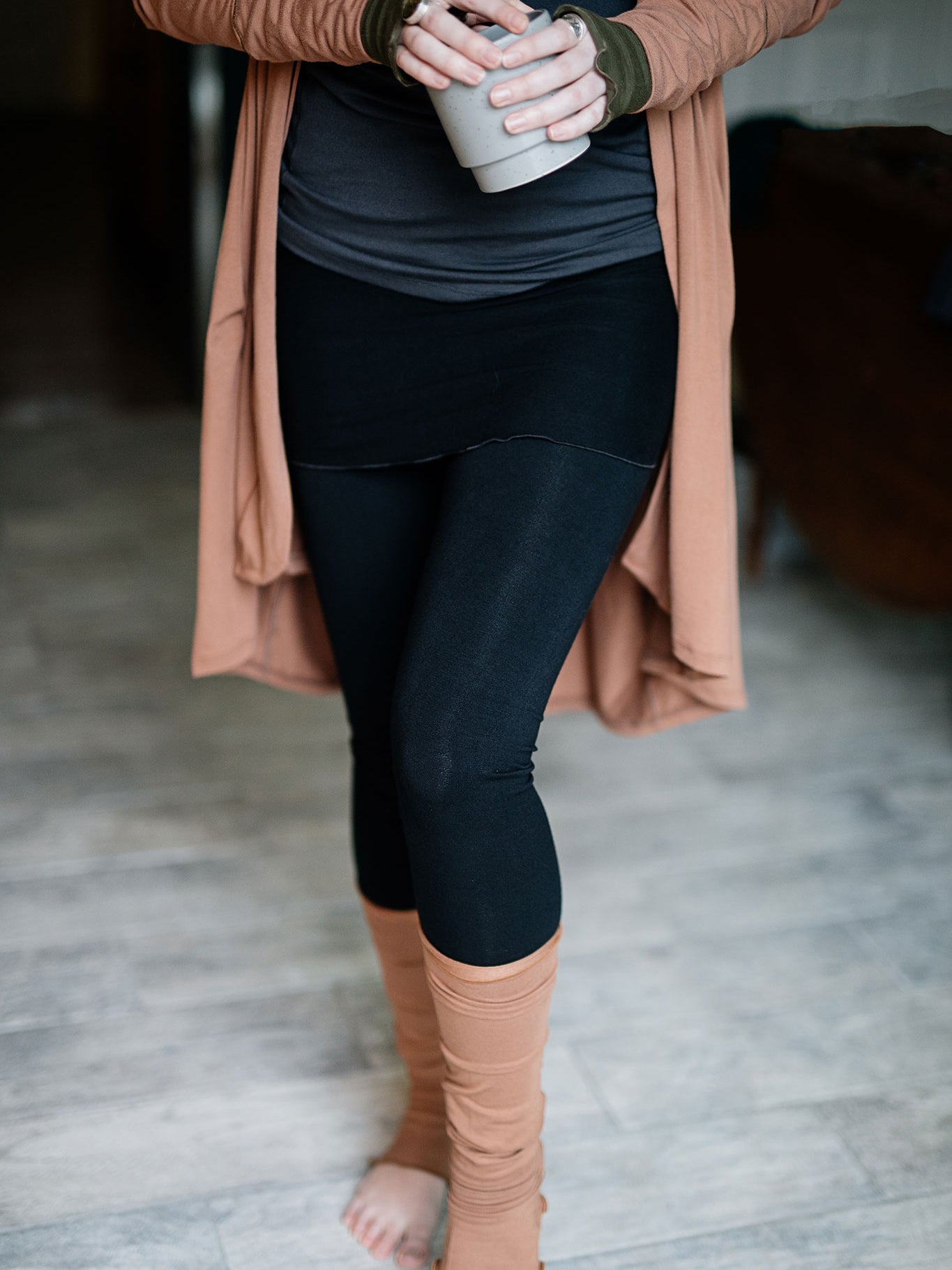 playsuit in black with top section folded over into a skirt; paired with coco jacket in cedar, cedar stockings, and core tank in carbon