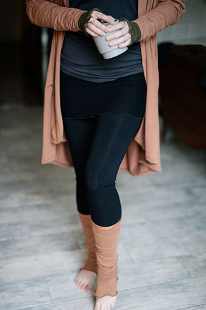 playsuit in black with top section folded over into a skirt; paired with coco jacket in cedar, cedar stockings, and core tank in carbon