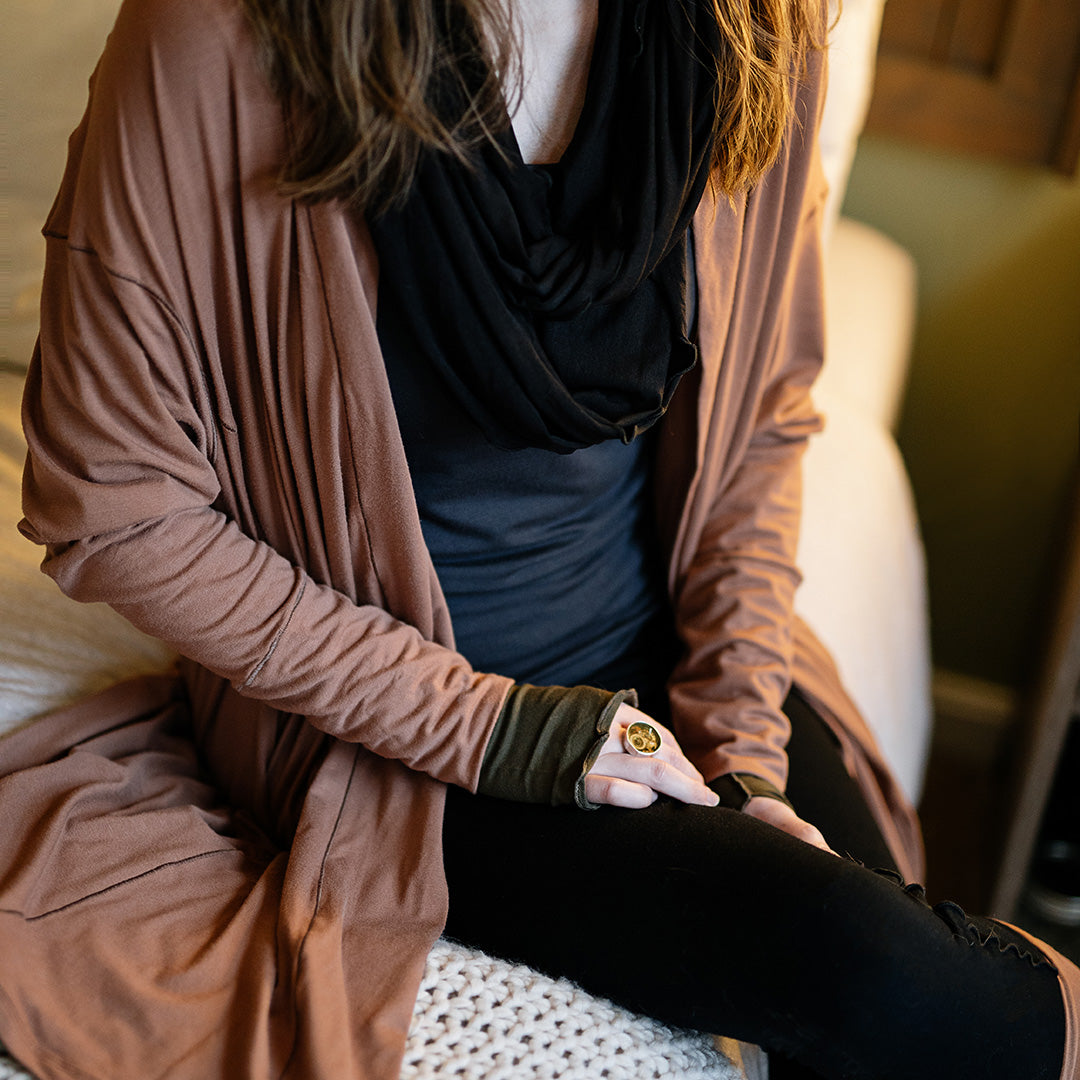 coco blazer in cedar paired with black playsuit, carbon core tank, and black loop around neck