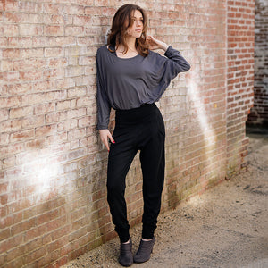 pop top in carbon worn tucked into black joggers