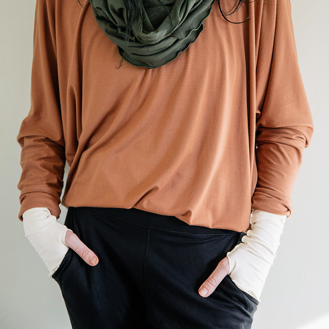 opera sleeves in milk with cedar pop top, fir loop around neck, and black jogger