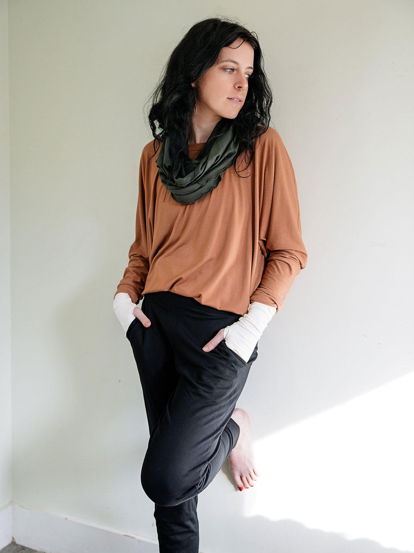 jogger sweatpant in black paired with poptop in cedar and fir loop around neck