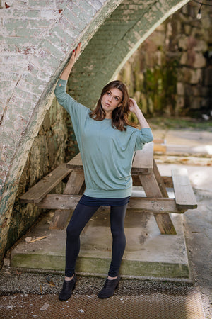 base legging in carbon paired with pop top in glass and hourglass in midnight worn as a skirt