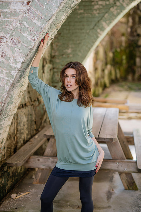 pop top in glass layered over hourglass in midnight worn as a skirt and base legging in carbon