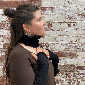 matching band worn at neck and opera sleeves, shown in black