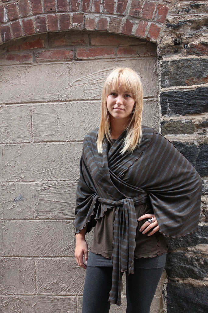 the wrap as a poncho in woodland