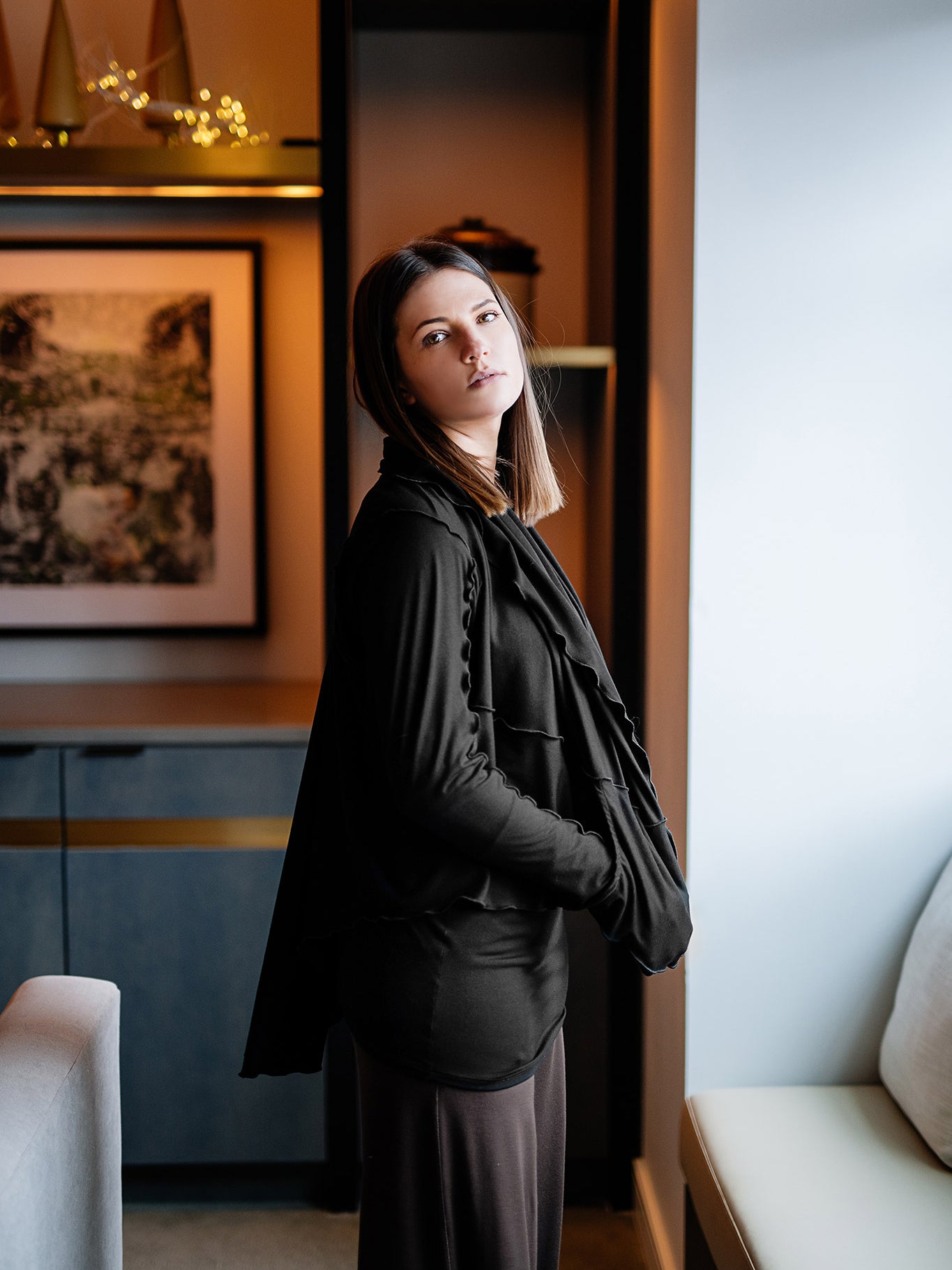 cardi in black over vital in black and peat harlow