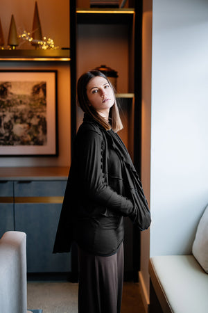 cardi in black over vital in black and peat harlow