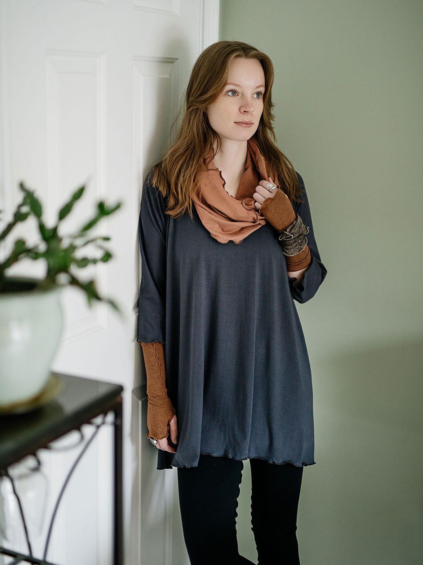 swing top in carbon paired with black playsuit, cedar hourglass around neck, and almond aria gloves