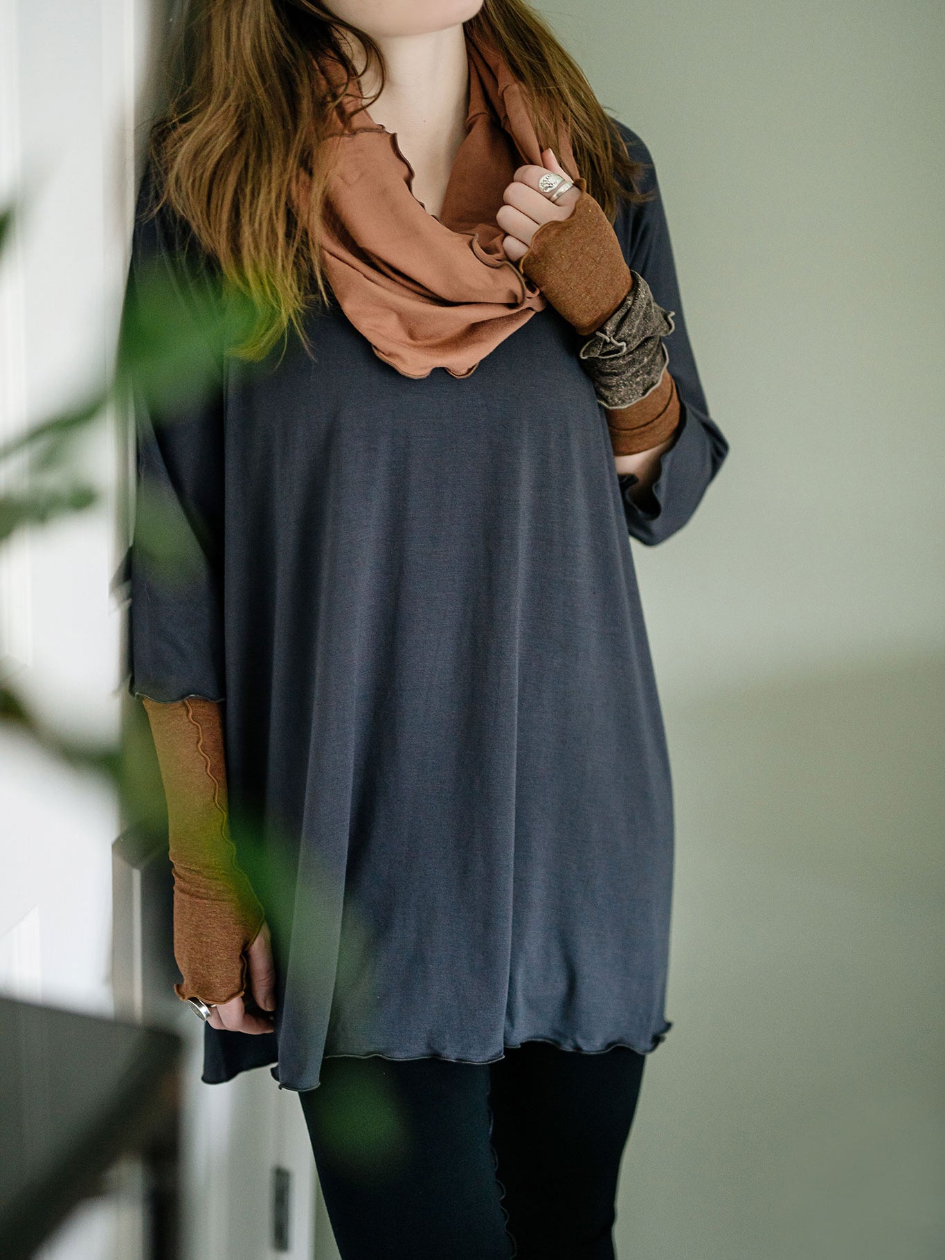 swing top in carbon paired with black playsuit, cedar hourglass around neck, and almond aria gloves