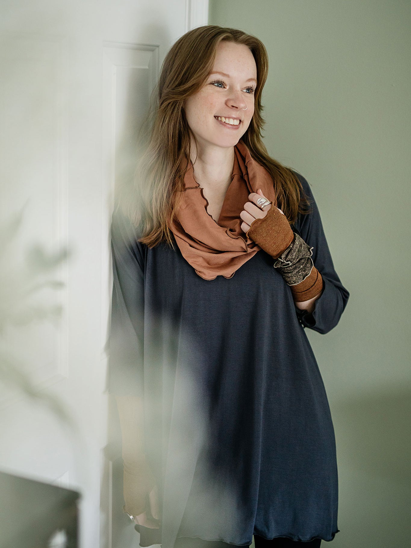 swing top in carbon paired with black playsuit, cedar hourglass around neck, and almond aria gloves