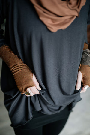 swing top in carbon paired with black playsuit, cedar hourglass around neck, and almond aria gloves