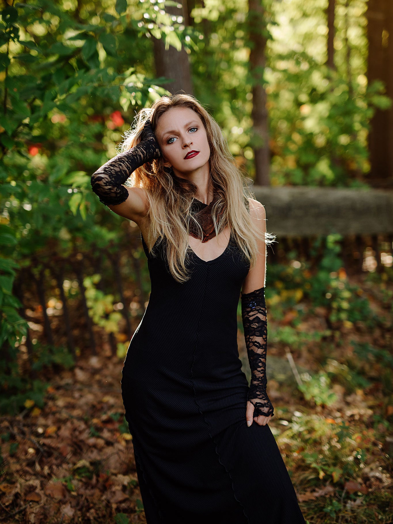 goddess dress in subtle black with black lace opera sleeves and spice mineral hourglass at neck