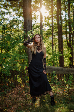 goddess dress in subtle black with black lace opera sleeves and spice mineral hourglass at neck