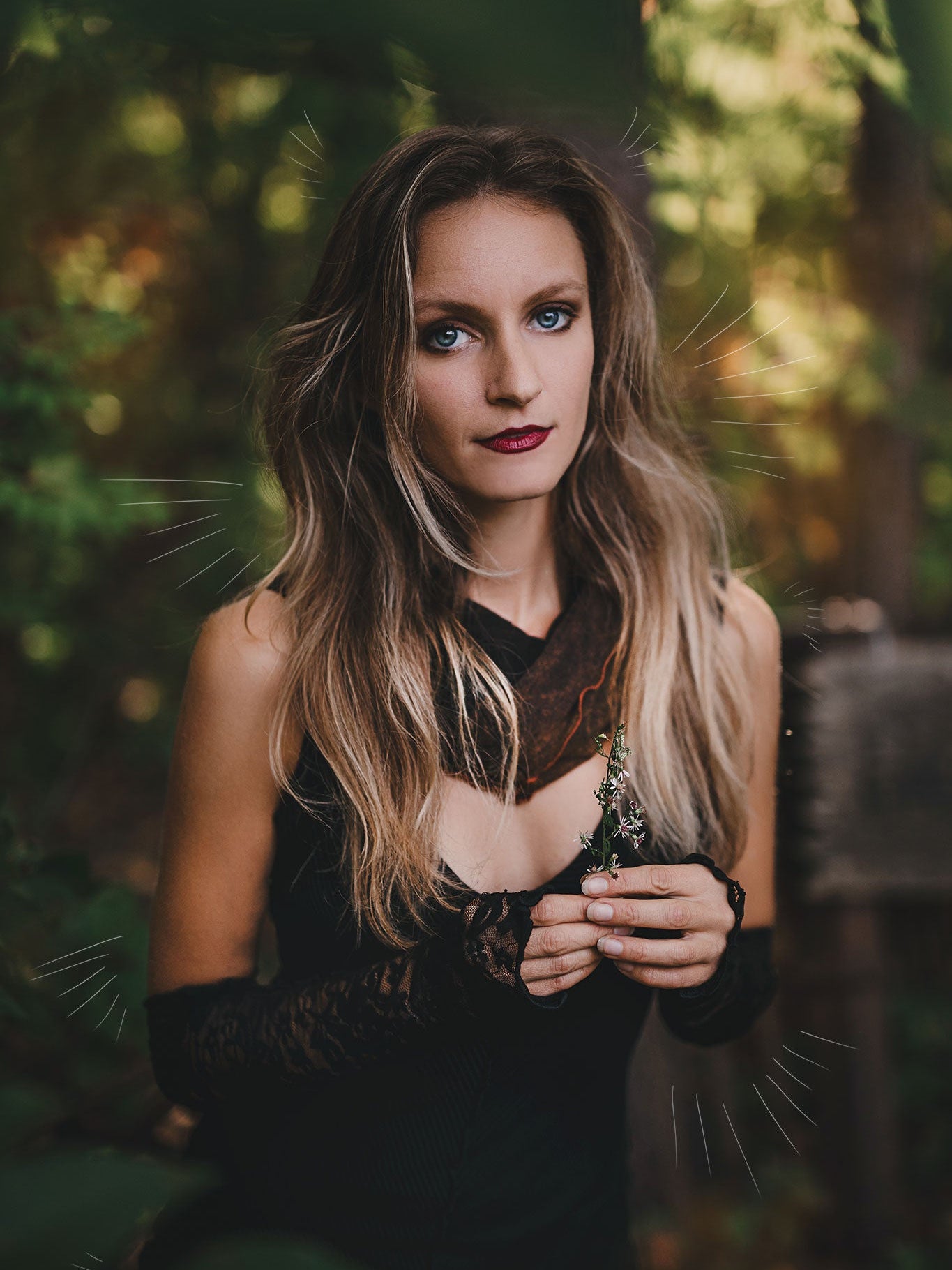 goddess dress in subtle black with black lace opera sleeves and spice mineral hourglass at neck