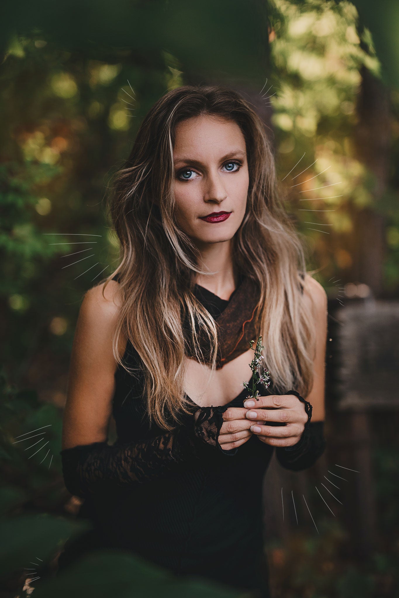 goddess dress in subtle black with black lace opera sleeves and spice mineral hourglass at neck