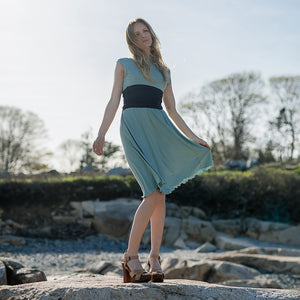 glow dress in glass with navy corset as a waist cincher