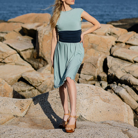 glow dress in glass with navy corset as a waist cincher