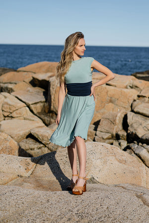 glow dress in glass with navy corset as a belt