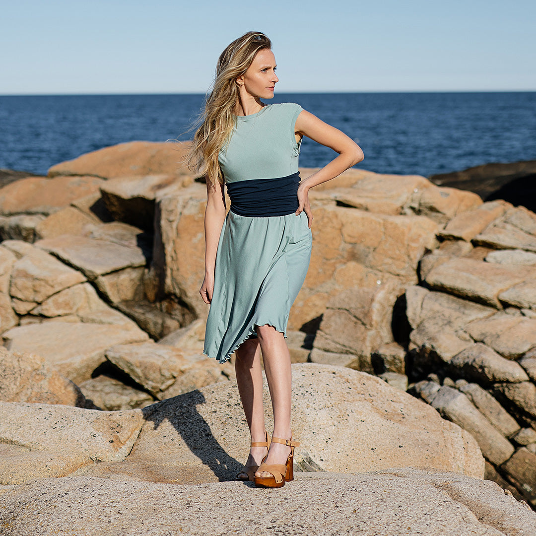 glow dress in glass with navy corset as a waist cincher