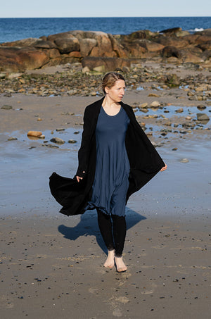 glow dress in navy with garden coat in black