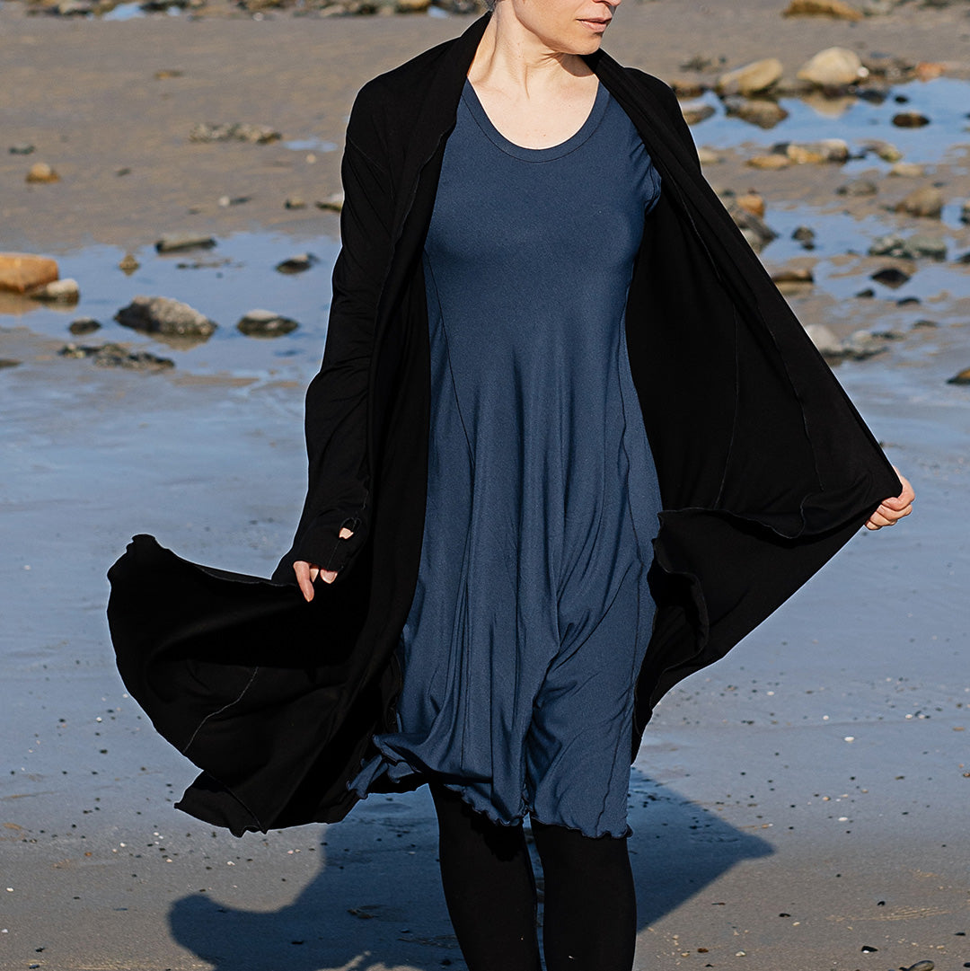 glow dress in navy paired with garden coat in black