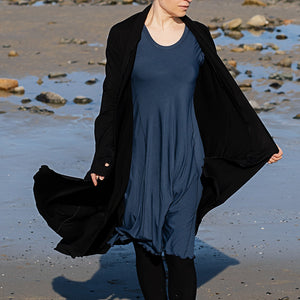 glow dress in navy paired with garden coat in black