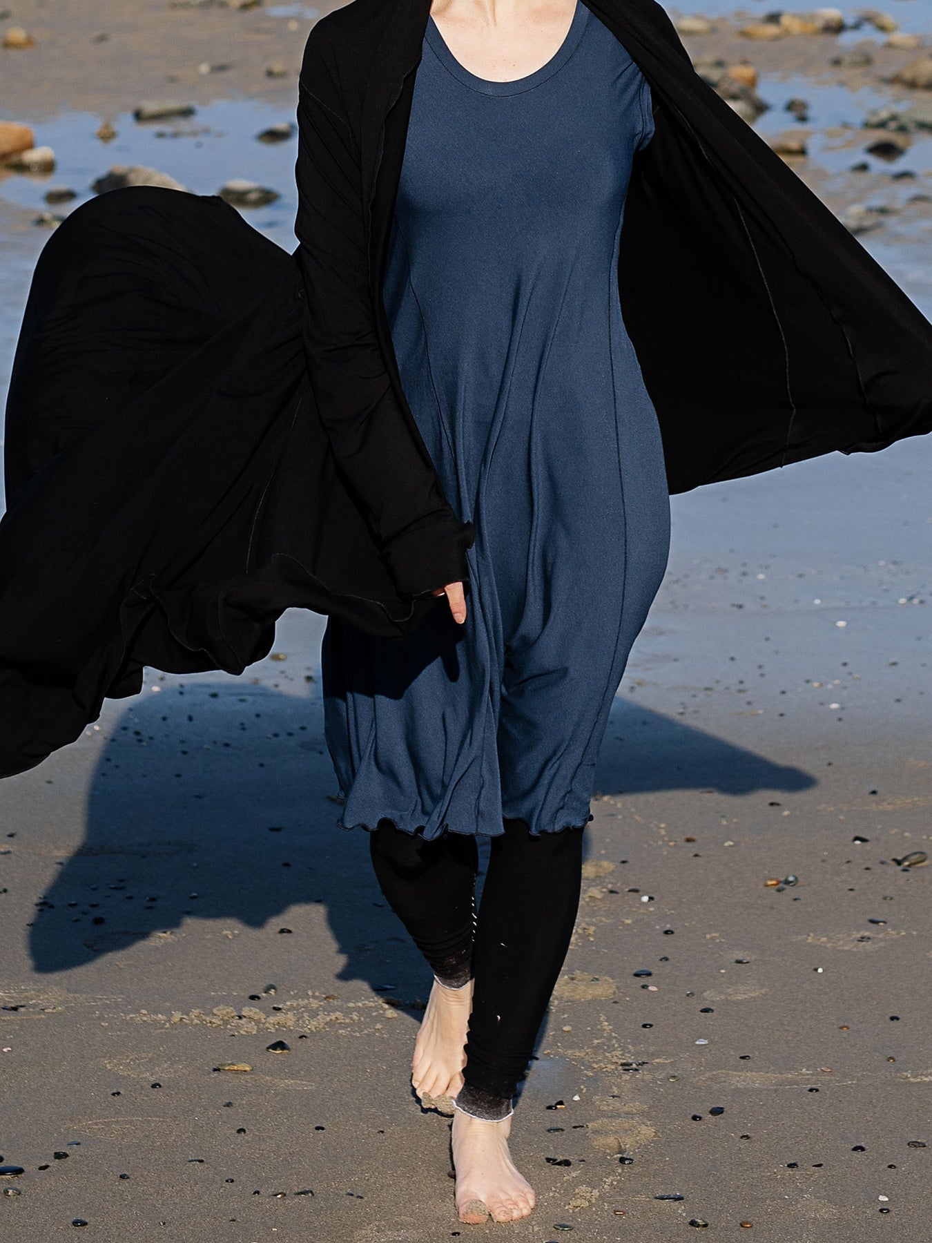 garden coat in black over glow dress in navy