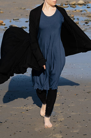 garden coat in black over glow dress in navy