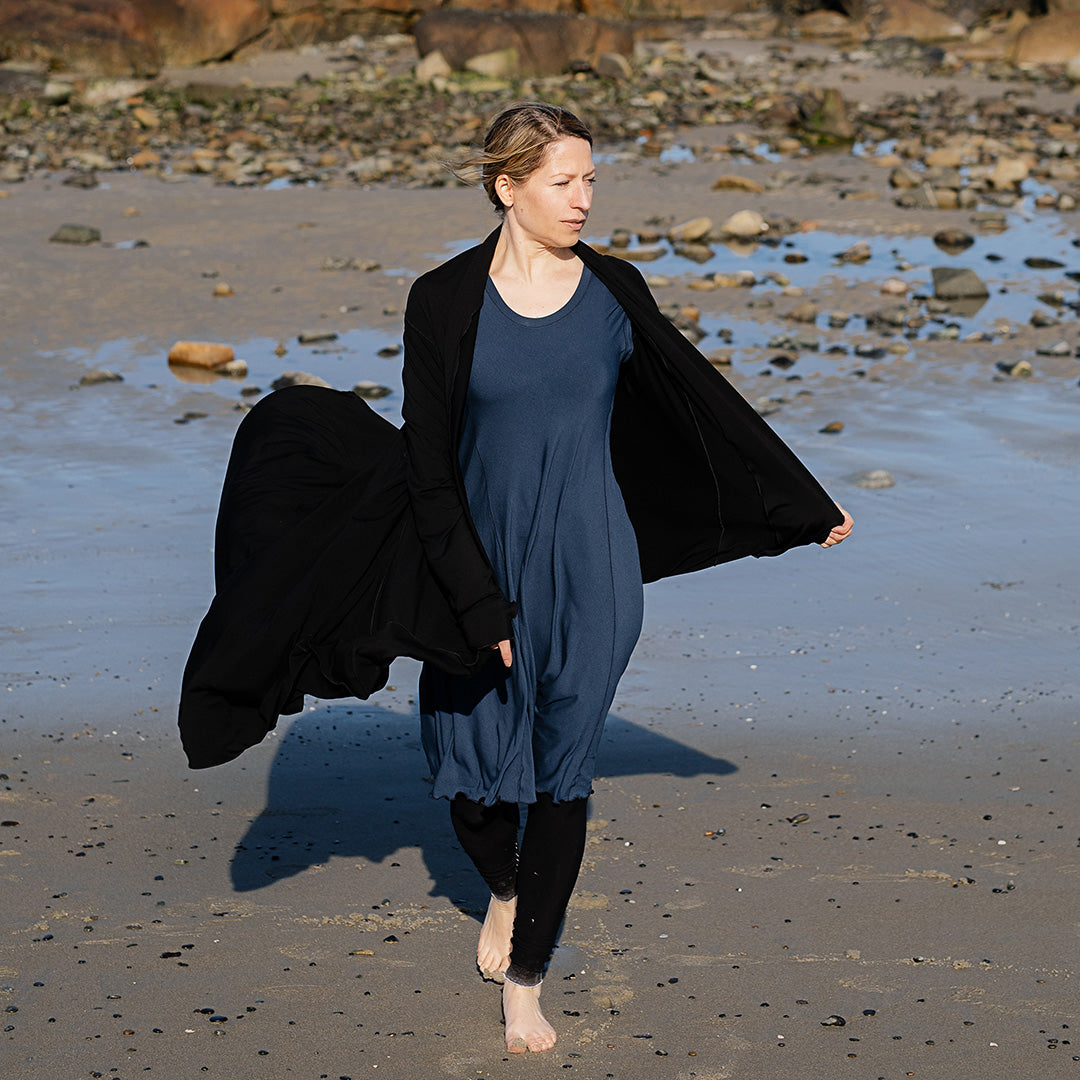 glow dress in navy paired with garden coat in black