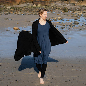 glow dress in navy paired with garden coat in black