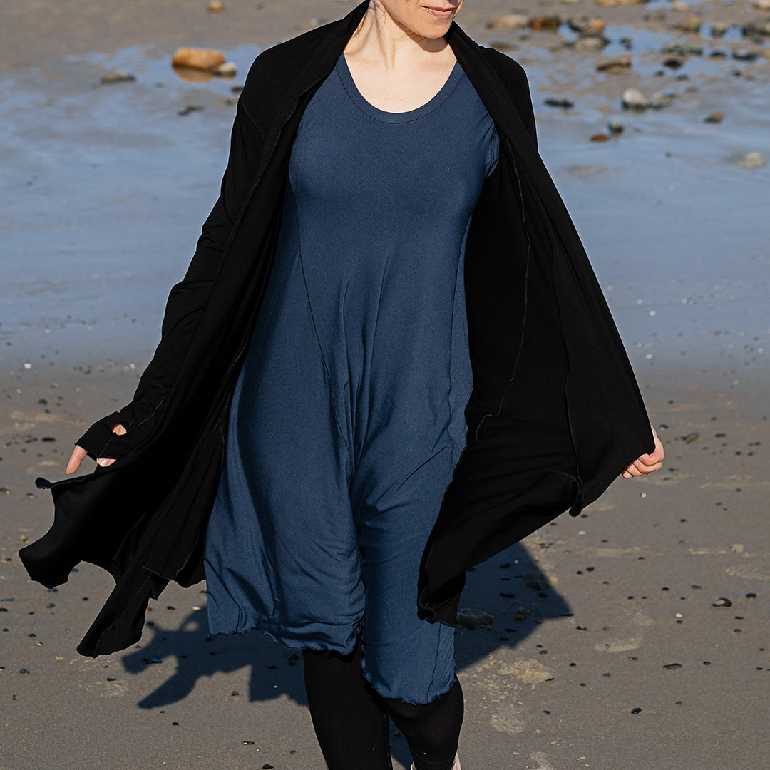 garden coat in black worn with glow dress in navy