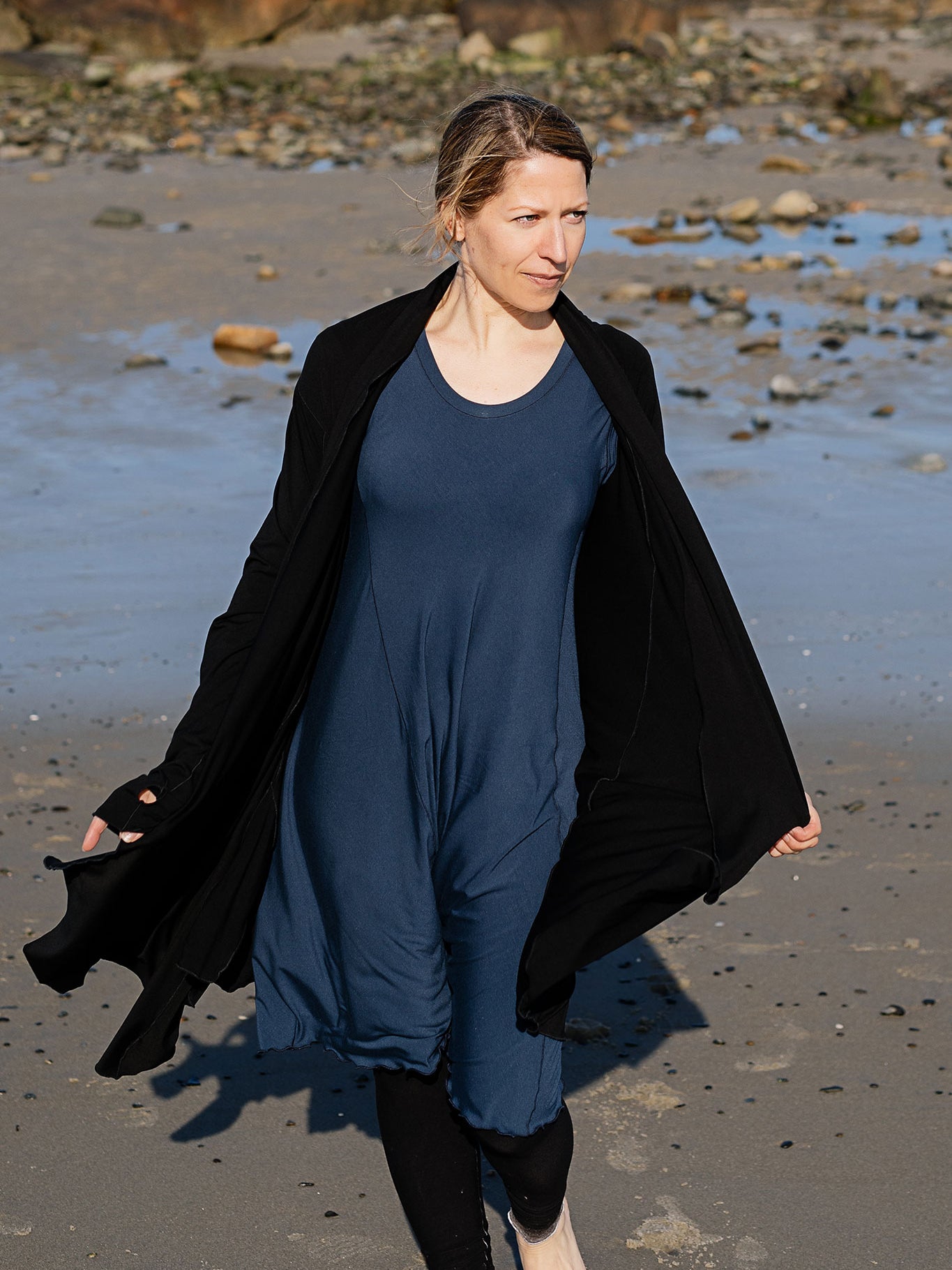 garden coat in black over glow dress in navy