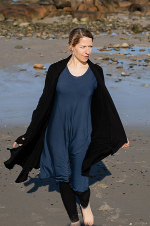 garden coat in black over glow dress in navy