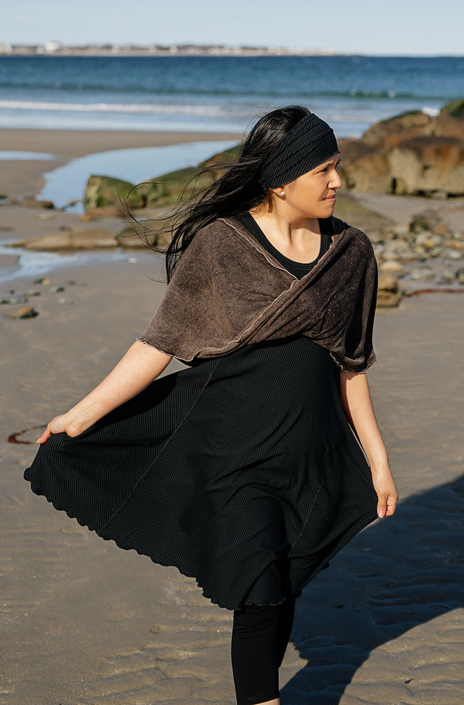 loop infinity scarf in mineral worn as a shawl over glow dress in subtle black