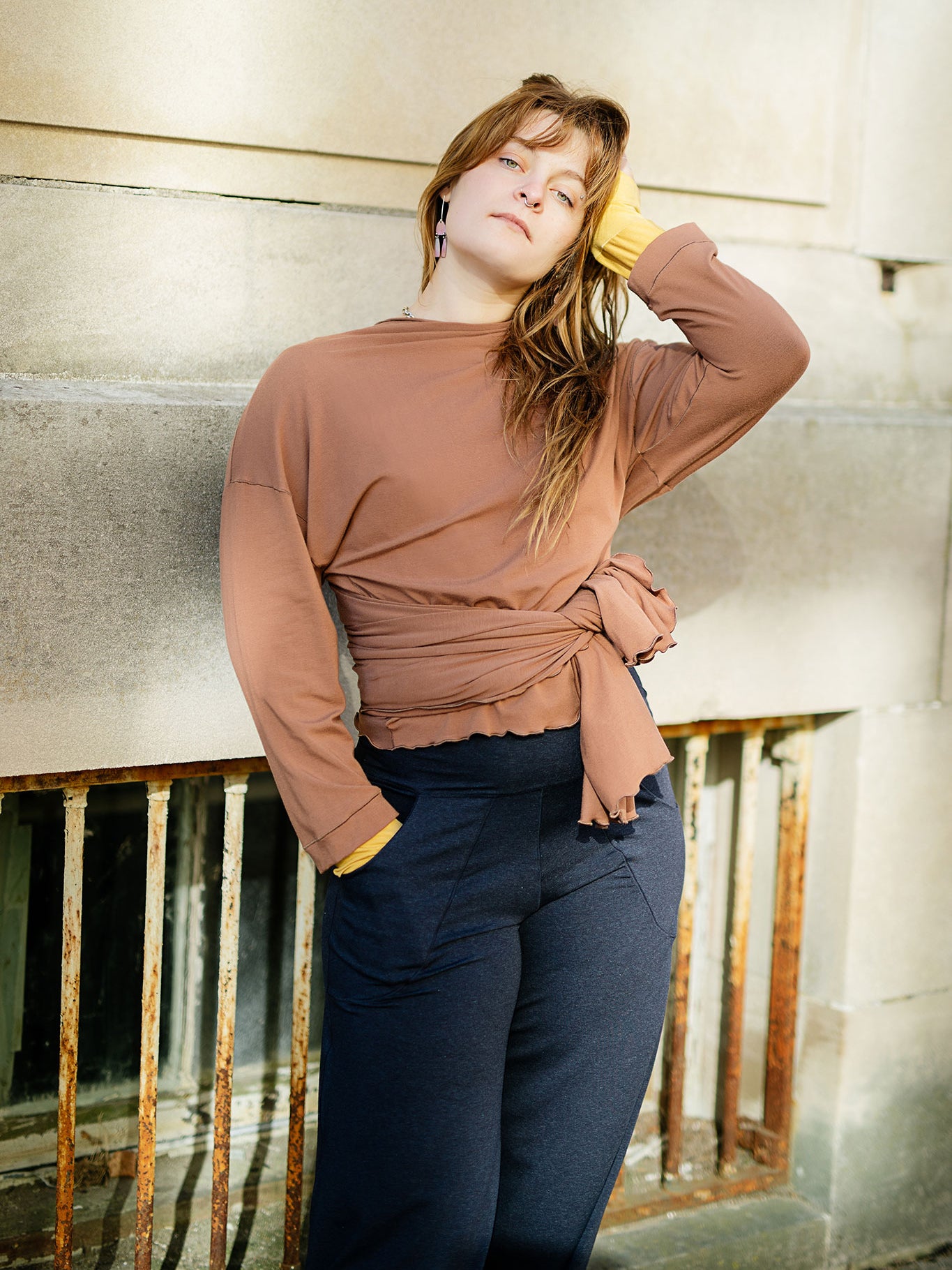 prima wrap jacket in cedar worn backwards and tied in the front over midnight harlow pant