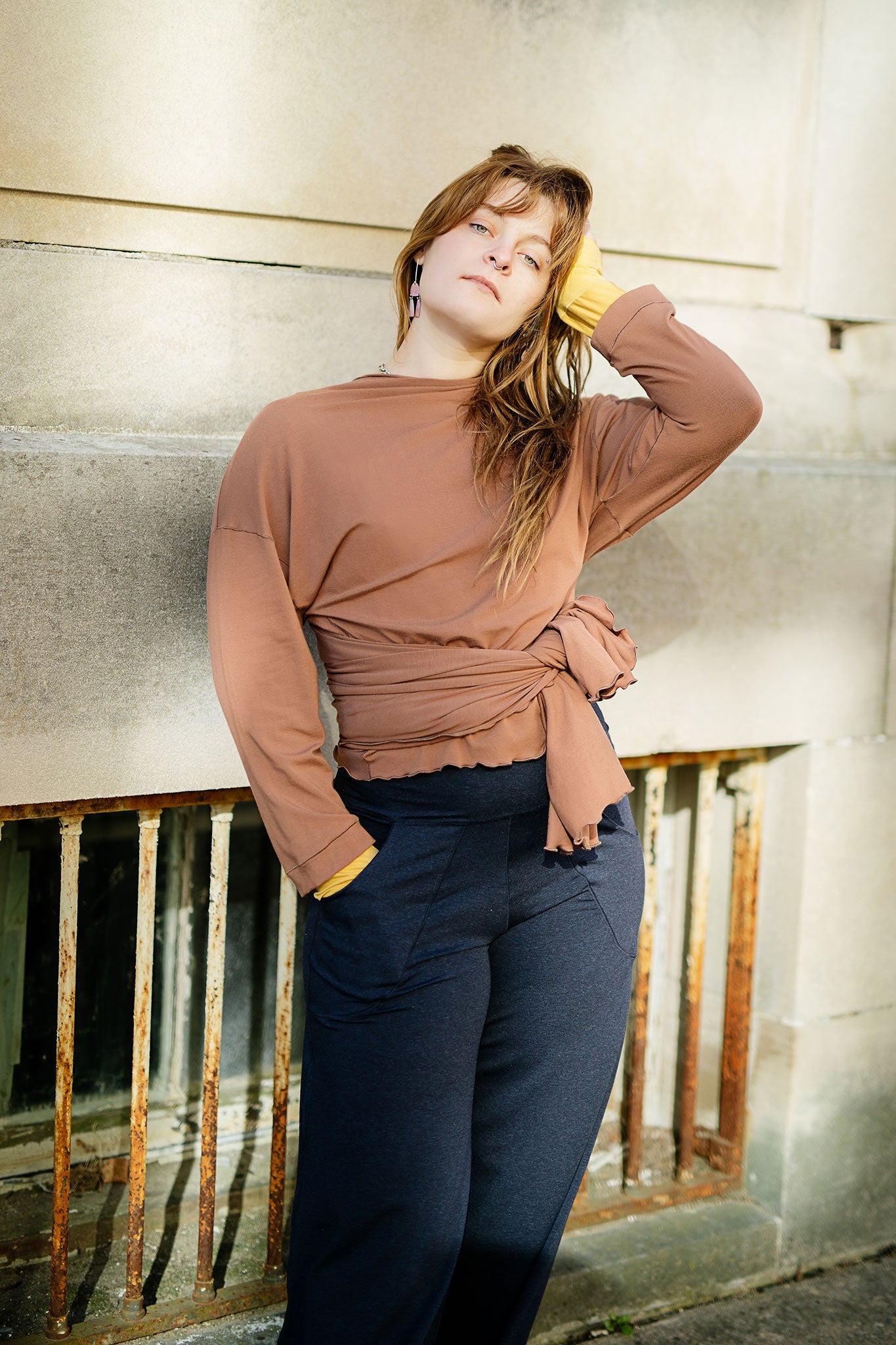 prima wrap jacket in cedar worn backwards and tied in the front over midnight harlow pant