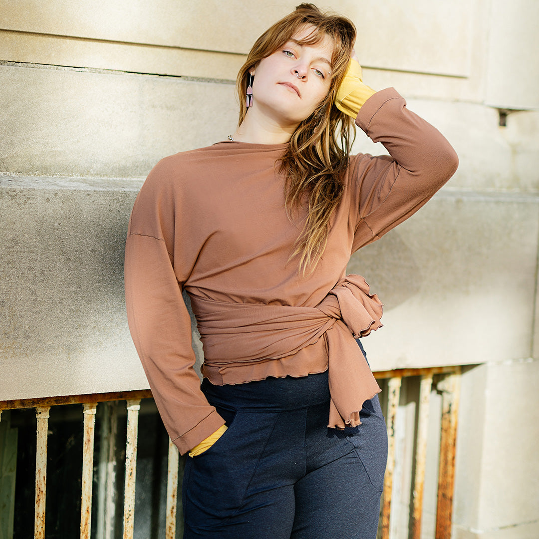 prima wrap jacket in cedar worn backwards and tied in the front