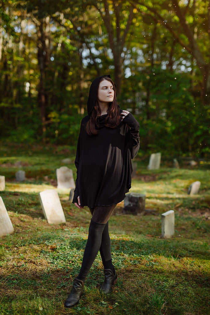 mountain cowl neck tunic in black with stockings in subtle black
