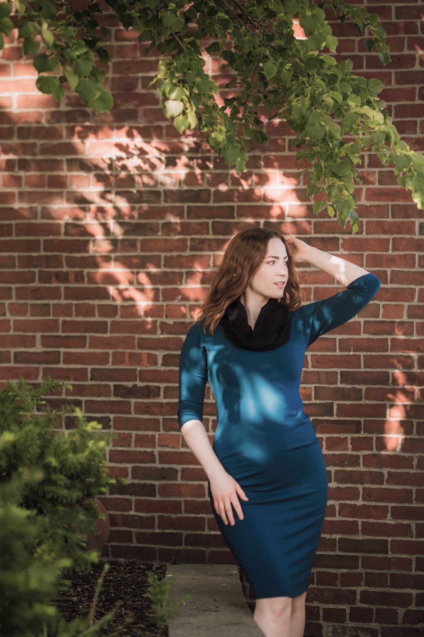 noble elegant dress in lagoon with black loop around neck