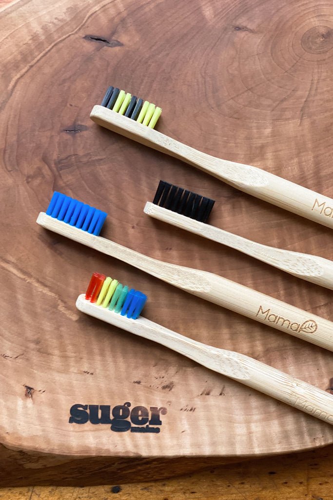 four different colors of the bamboo toothbrush