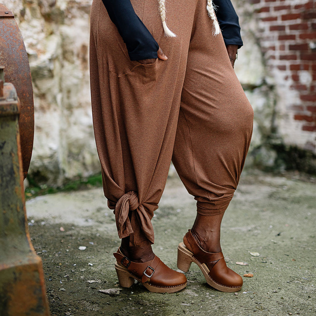 farmer jumpsuit in almond heather with leg slits tied up
