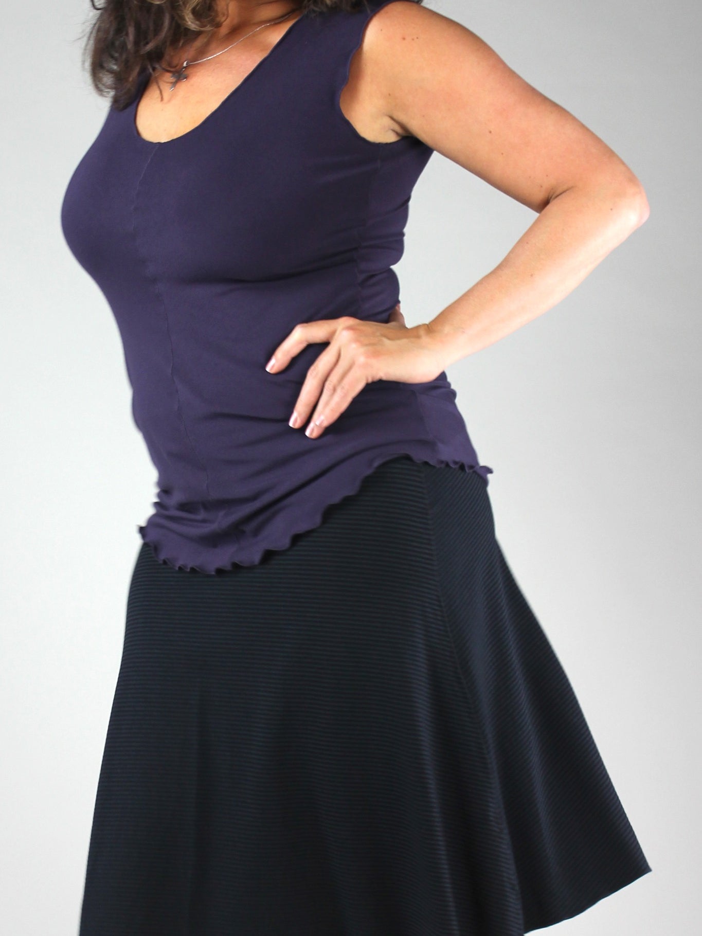 suger® flip skirt in black paired with indigo shell